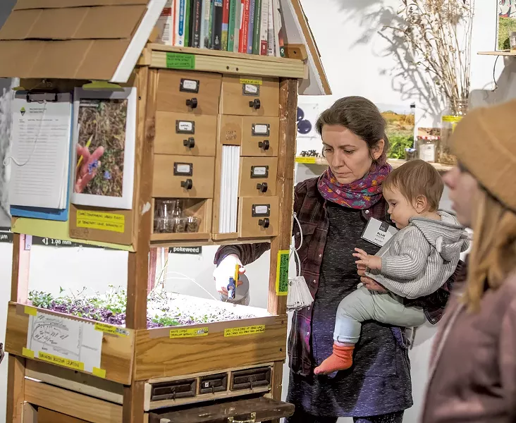 "Next Epoch Seed Library" co-collaborator Ellie Irons with her daughter - LUKE AWTRY