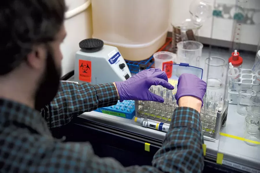 Philip Cannata processing samples at Burlington Labs. - JAMES BUCK