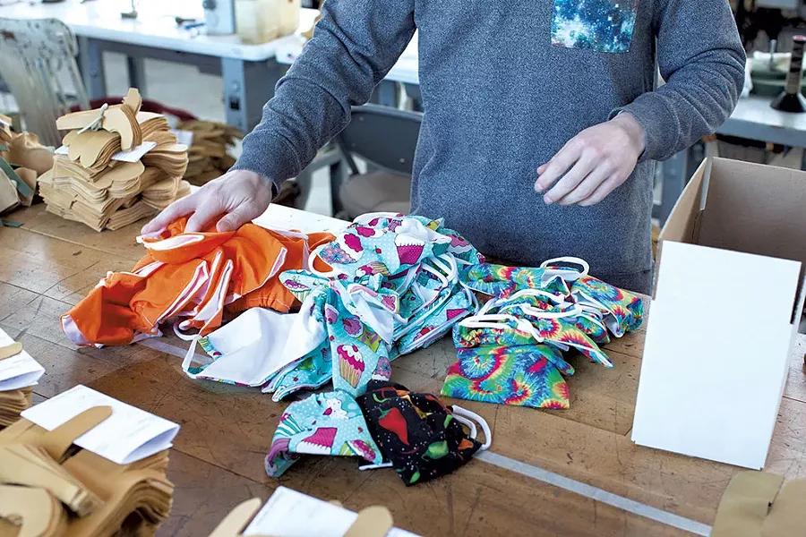 Vermont Glove president Sam Hooper showing off some of his newly produced face masks - COURTESY OF VERMONT GLOVE/ADAM PLOTSKY