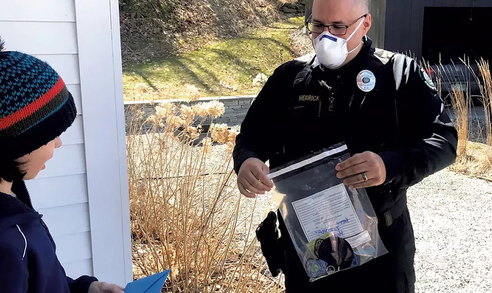 Hudson Brown and Officer Ben Herrick - COURTESY OF MARIA BROWN