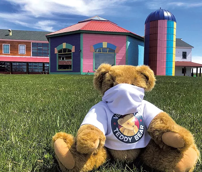 A masked bear outside the factory