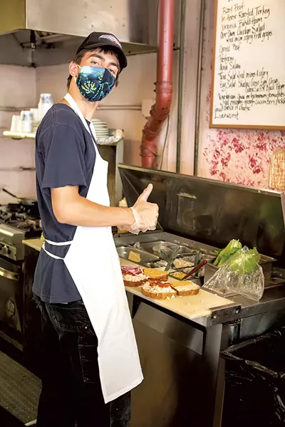 Red Onion Café Zachary James making sandwiches at Red Onion Café - LUKE AWTRY ©️ SEVEN DAYS