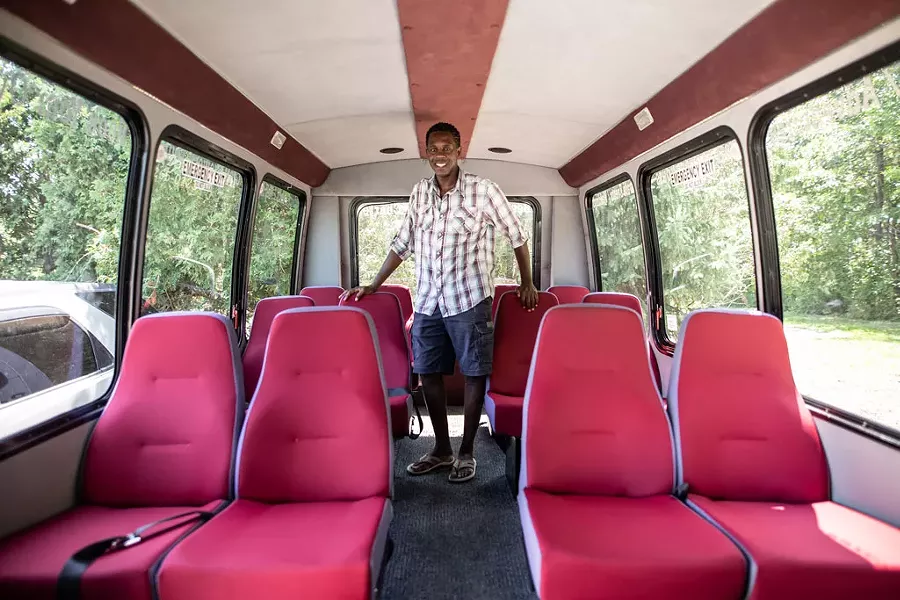 Tinotenda "Tino" Charles Rutanhira and his tour bus - LUKE AWTRY