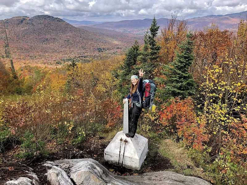 Jocelyn Hebert at the end of the Long Trail on the Canada border - COURTESY OF JOCELYN HEBERT