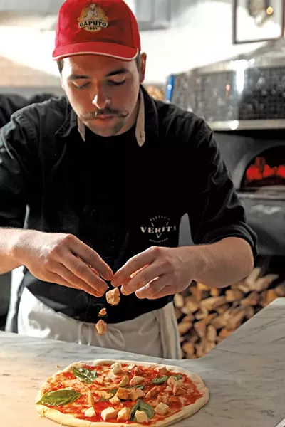 Griffeon Chuba making a pizza. - MATTEHW THORSEN