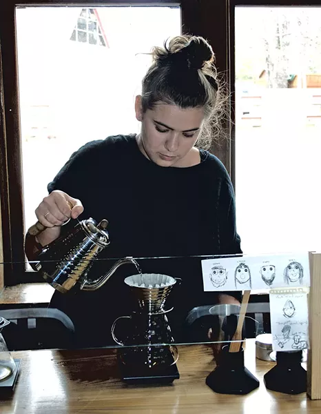 Camille Berlioz making a pour-over at Maglianero - SUZANNE PODHAIZER