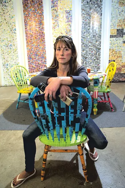 Kristen M. Watson with "FEED (Alone, together)" in front of her "TMI Prints" series - MATTHEW THORSEN