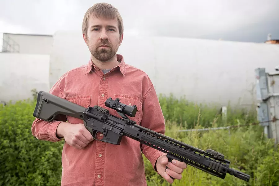 Seven Days political editor Paul Heintz on Monday with an AR-15 - JAMES BUCK