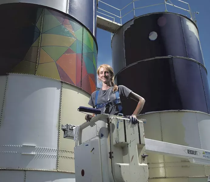 Mary Lacy painting silos at Dealer.com - FILE: MATTHEW THORSEN