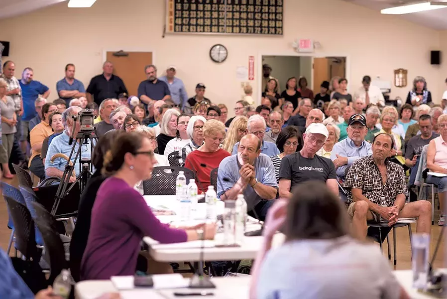 Rutland residents hear about refugee resettlement plans last May at a meeting of the Board of Aldermen. - CALEB KENNA