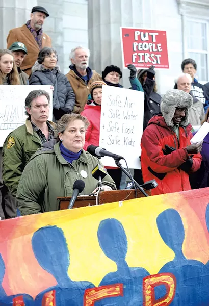 Mari Cordes of Rights & Democracy speaking at a rally last Wednesday outside the Statehouse - JEB WALLACE-BRODEUR