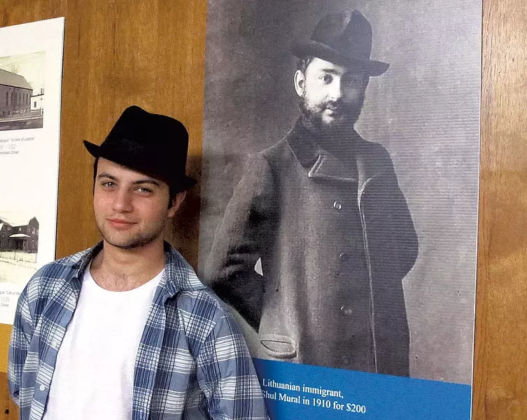 Timothy Lewis with a photo of Ben Zion Black - SHARON PANITCH
