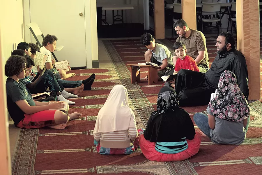 Imam Islam Hassan (far right) with his students - MATTHEW THORSEN