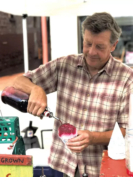 John Hayden of the Farm Between making a sno-cone - SUZANNE M. PODHAIZER