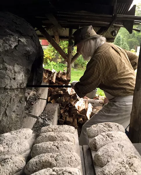 Peter Schumann baking rye bread - SALLY POLLAK