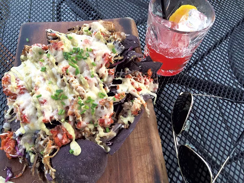 Nachos and a drink - SALLY POLLAK