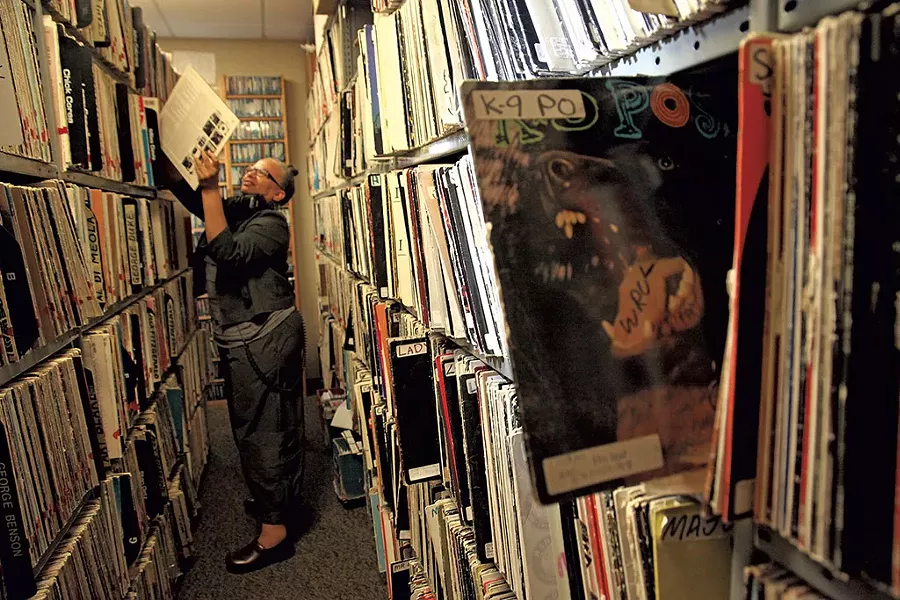 Melo Grant in the record stacks at WRUV - MATTHEW THORSEN
