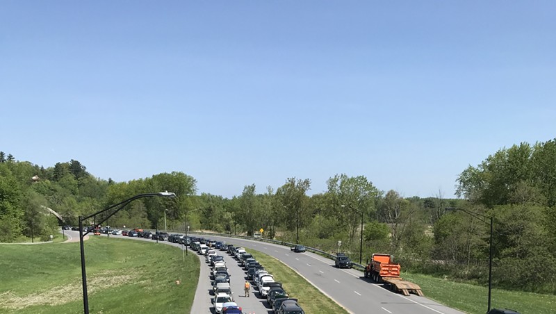 Cars waiting in line to receive food on the Beltline Tuesday in Burlington