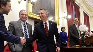 Sen. Tim Ashe, left, shakes Gov. Phil Scott's hand at the governor's budget address on January 24, 2019.