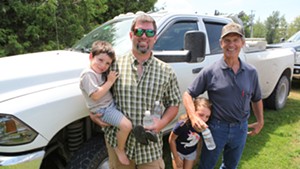 Kurt Magnan, his two kids, and his father, Jim Magnan, after the vote Monday