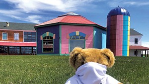 A masked bear outside the factory