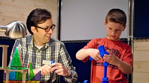 Marcos Stafne engaging in hands-on science with young patron