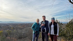 Corey with her family and friend hiking in Colchester