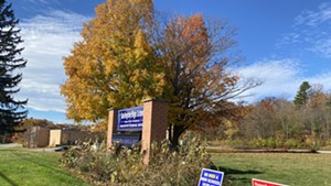 Dueling signs in front of Burlington High School's Institute Road campus