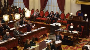 Rep. Maida Townsend (center-left) speaks on the House floor Wednesday.