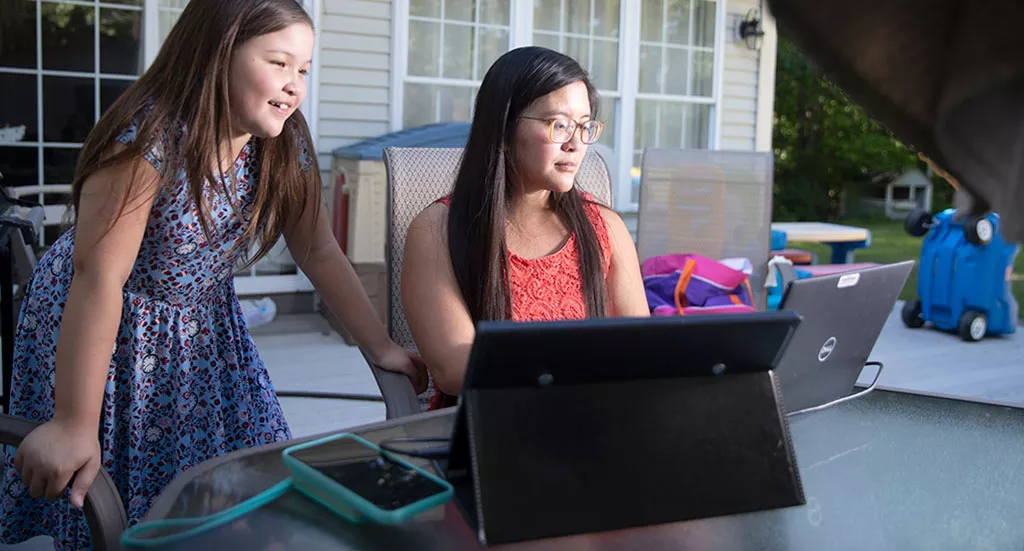 Cao working from home with her daughter - JAMES BUCK