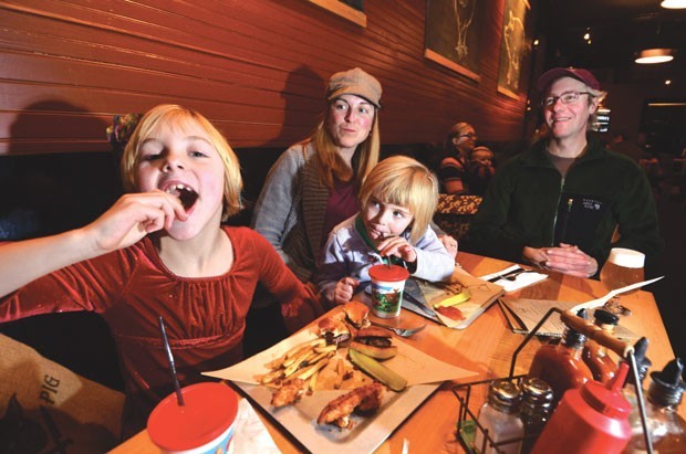 Karen and Sean Lawson of Warren enjoy dinner with their daughters Ava, left, and Jade.