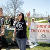 Associate professor of English Sarah Alexander (center front) speaking to passersby