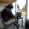 Mitch Hunt using the Wi-Fi outside of the Craftsbury library