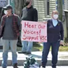 Protesters in Johnson urging passersby to support the colleges Protesters in Johnson urging passersby to support the colleges