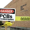 Signs warning about PCBs at Burlington High School Signs warning about PCBs at Burlington High School