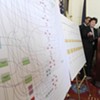 Department of Financial Regulation Commissioner Susan Donegan points to a chart detailing the alleged inappropriate flow of funds within Jay Peak and Q Burke EB-5 projects during a press conference Thursday at the Statehouse.