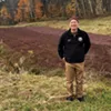Bob Lesnikoski in front of a cranberry bog Bob Lesnikoski in front of a cranberry bog
