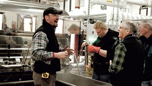 Workers monitor and test the syrup at Sweet Tree's Island Pond plant