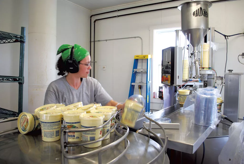 Workers processing dairy products at Butterworks Farm - KATHRYN FLAGG