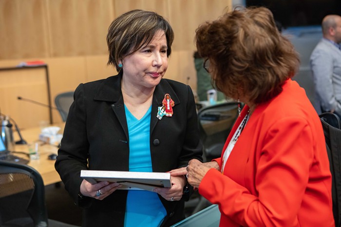 Juarez speaking in the council chambers following a committee meeting.