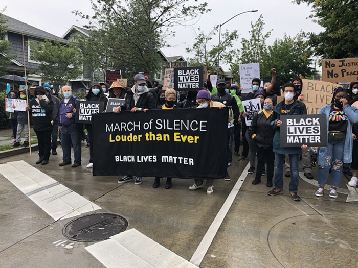 BLMKC board members quietly leading the way down 23rd.