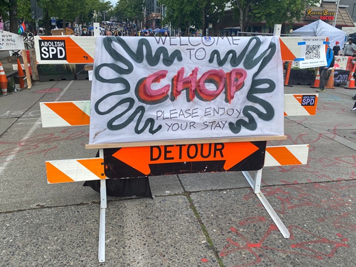 Signs around CHOP declare its new name, which stands for Capitol Hill Organized Protest, although some disagree with the new name. Signs around CHOP declare its new name, which stands for Capitol Hill Organized Protest, although some disagree with the new name.
