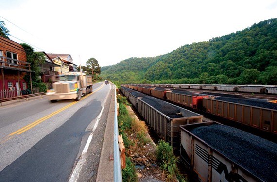 Coal rail cars and trucks ship Massey coal at Williamson, W.Va. - SCOTT ELMQUIST