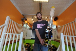 George Conway, of Kulture, with one of the store’s most extravagant contraptions, the Kurt B. Honey Bear, by Illadelph Glass. - SCOTT ELMQUIST