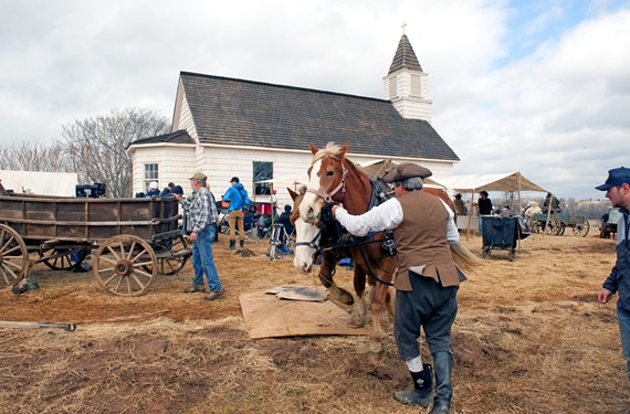 Horses and wagons are prepared for their moment on camera during a scene in episode seven, filmed in February. The church, which sits on top of a hill, was built for the season’s pilot, which shot locally in April 2013. - SCOTT ELMQUIST