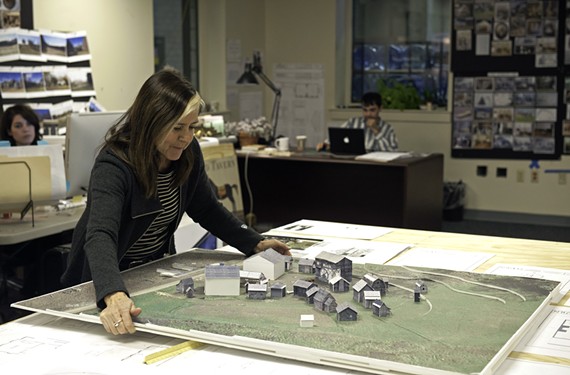 In the art department, Production Designer Caroline Hanania shows a model of the little town of Setauket. Its life-sized version appears on a Goochland County set, with interiors replicated on a sound stage near the Richmond International Raceway. - SCOTT ELMQUIST