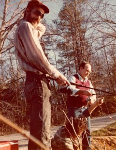 Rik Davis and Lester Blackiston, far right, fish at an unknown location.
