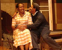 Rochelle Turnage as Rose and J. Ron Fleming as Troy in August Wilson's “Fences,” running through November 20 at Pine Camp Cultural Arts Center.
