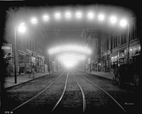 Shot in Norfolk, photographer Harry Mann's "Night View ...  Along Granby Street" (1914) is one of many pieces of night photorgaphy that beg imaginative narrative from the viewer.