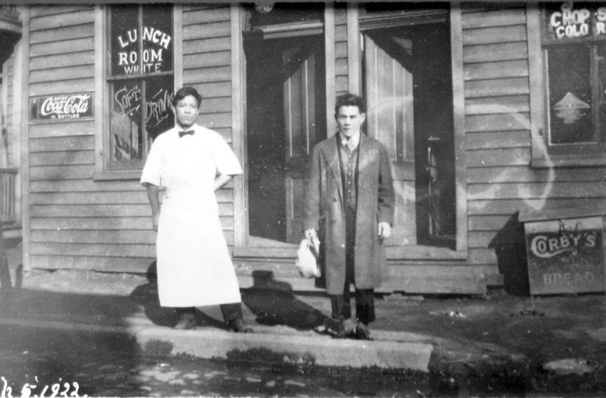 Stilson captured these restaurateurs, whom he identified as Japanese, in Shockoe outside their establishment with clearly marked entrances and dining rooms for “whites” and “colored.” - COPYRIGHT RICHMOND IN SIGHT